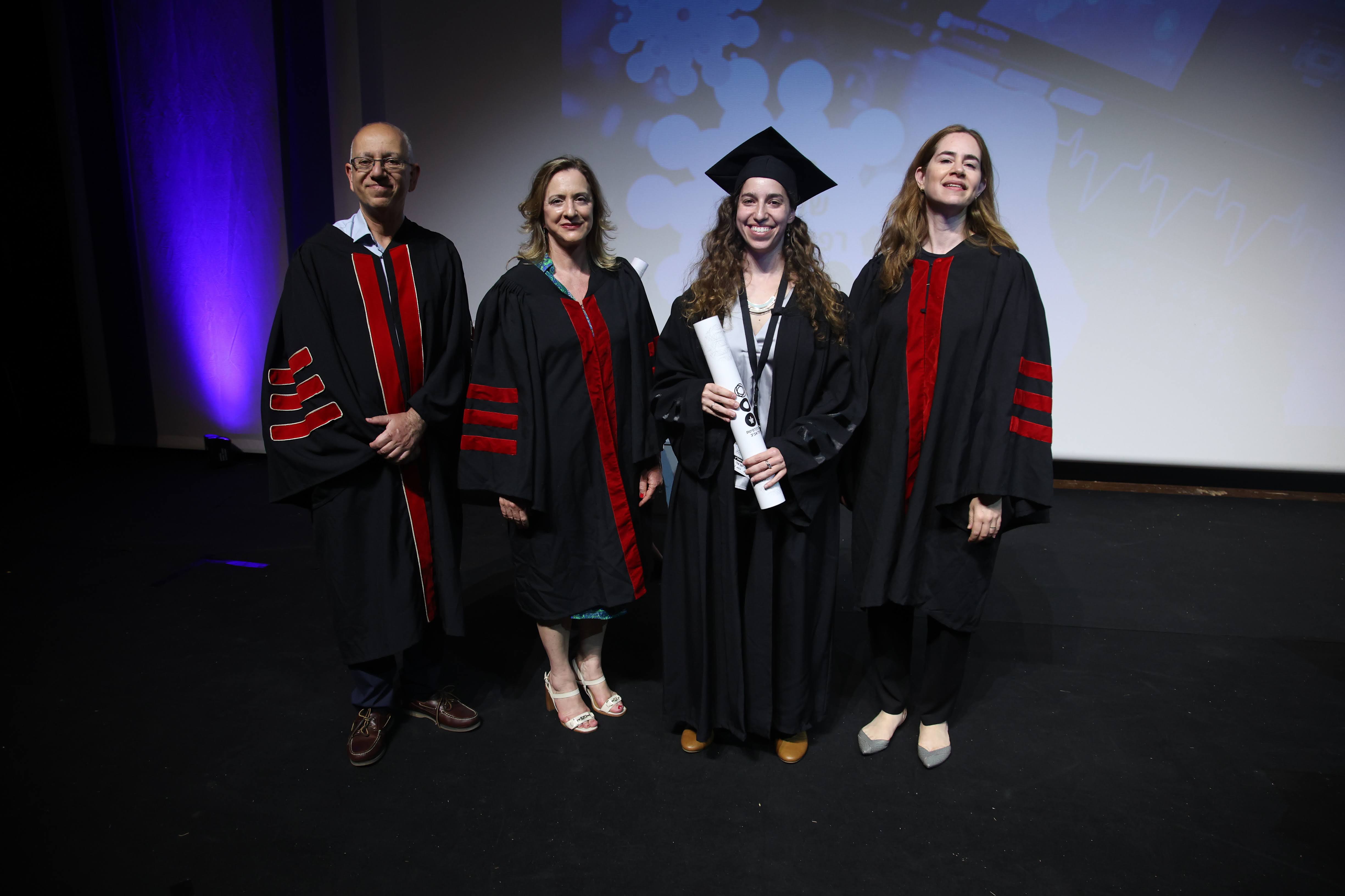 Accepting M.D. diploma on stage at Tel Aviv University